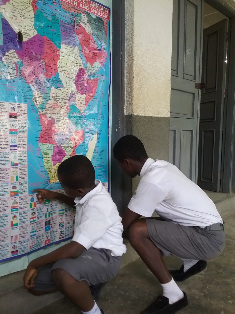 Students tracing some locations on the map